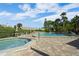 Community pool and hot tub area with patio furniture at 5958 Clubside Dr, Sarasota, FL 34243