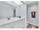 Bathroom with white vanity, toilet and a brown towel at 6507 Stone River Rd # 306, Bradenton, FL 34203