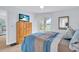 Bright bedroom with a dresser and balcony access at 6507 Stone River Rd # 306, Bradenton, FL 34203