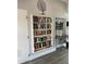 Community library with bookshelves and water cooler at 6507 Stone River Rd # 306, Bradenton, FL 34203