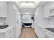 Bright condo kitchen with white cabinets and breakfast bar at 6507 Stone River Rd # 306, Bradenton, FL 34203