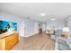 Living room with hardwood floors and access to balcony at 6507 Stone River Rd # 306, Bradenton, FL 34203