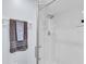 Clean shower with glass enclosure and a brown towel at 6507 Stone River Rd # 306, Bradenton, FL 34203