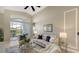 Comfortable living room featuring ample seating, a decorative mirror, and a view to the lanai at 6510 42Nd E St, Sarasota, FL 34243