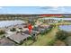 Community view showing home's location near a community center and lake at 6519 Rosehill Farm Run, Bradenton, FL 34211