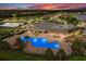 Night view of community pool and amenities at 6519 Rosehill Farm Run, Bradenton, FL 34211