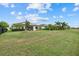 Large backyard with a screened patio and solar panels at 6519 Rosehill Farm Run, Bradenton, FL 34211