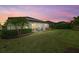 Spacious backyard oasis with patio, hot tub, and solar panels at 6519 Rosehill Farm Run, Bradenton, FL 34211