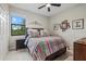 Bedroom with a double bed, nightstand and window at 6519 Rosehill Farm Run, Bradenton, FL 34211