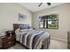 Comfortable bedroom with large window, providing ample natural light at 6519 Rosehill Farm Run, Bradenton, FL 34211