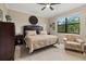 Spacious Primary bedroom with a king-size bed and sitting area at 6519 Rosehill Farm Run, Bradenton, FL 34211