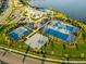 Aerial view of tennis courts, pool, and clubhouse at 6519 Rosehill Farm Run, Bradenton, FL 34211