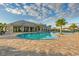 Relaxing freeform pool with surrounding patio at 6519 Rosehill Farm Run, Bradenton, FL 34211