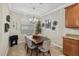 Charming dining room with wood table, chairs, and decorative wall art at 6519 Rosehill Farm Run, Bradenton, FL 34211