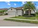 Beautiful two-car garage home with lush landscaping at 6519 Rosehill Farm Run, Bradenton, FL 34211