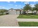 Two-story house with a two-car garage and palm trees at 6519 Rosehill Farm Run, Bradenton, FL 34211
