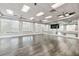 Fitness room or studio with mirrors and wood flooring at 6519 Rosehill Farm Run, Bradenton, FL 34211