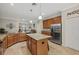 Spacious kitchen with large island, granite counters & stainless steel appliances at 6519 Rosehill Farm Run, Bradenton, FL 34211
