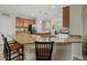 Kitchen features granite countertops and a large island with seating at 6519 Rosehill Farm Run, Bradenton, FL 34211