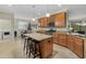 Open concept kitchen with granite counters and stainless steel appliances at 6519 Rosehill Farm Run, Bradenton, FL 34211