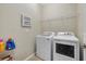 Laundry room with washer, dryer, and shelving at 6519 Rosehill Farm Run, Bradenton, FL 34211