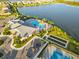Community clubhouse and pool near a lake at 6519 Rosehill Farm Run, Bradenton, FL 34211