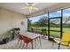 Relaxing screened porch with outdoor furniture and grill at 6519 Rosehill Farm Run, Bradenton, FL 34211