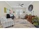 Sitting area with two armchairs, a rug, and a wooden cabinet at 6519 Rosehill Farm Run, Bradenton, FL 34211