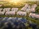 Aerial view of community with lake reflections at 7022 Prosperity Cir # 801, Sarasota, FL 34238