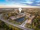 Aerial view of community with lake and homes at 7022 Prosperity Cir # 801, Sarasota, FL 34238