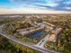 Aerial view of community with lake and homes at 7022 Prosperity Cir # 801, Sarasota, FL 34238