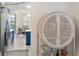 Stylish bar cabinet with woven details in dining area at 7022 Prosperity Cir # 801, Sarasota, FL 34238