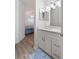 Bright bathroom with white vanity, quartz countertop and a walk-in shower at 7022 Prosperity Cir # 801, Sarasota, FL 34238
