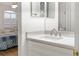 Modern bathroom vanity with white cabinets, quartz countertop, and chrome fixtures at 7022 Prosperity Cir # 801, Sarasota, FL 34238