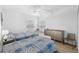Guest bedroom with two twin beds, a dresser, and window seat at 7022 Prosperity Cir # 801, Sarasota, FL 34238