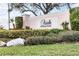 Ariel on Palmer Ranch community entrance with lush landscaping at 7022 Prosperity Cir # 801, Sarasota, FL 34238