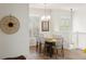 Open concept dining area with loft and white railings at 7022 Prosperity Cir # 801, Sarasota, FL 34238