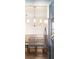 Modern dining room with a stylish chandelier and light wood chairs at 7022 Prosperity Cir # 801, Sarasota, FL 34238