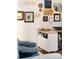 Home office with built-in desk and eclectic wall art at 7022 Prosperity Cir # 801, Sarasota, FL 34238