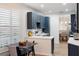 Eat-in kitchen with white quartz countertops and dark wood cabinetry at 7022 Prosperity Cir # 801, Sarasota, FL 34238