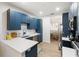 Modern kitchen with white quartz countertops and dark blue cabinetry at 7022 Prosperity Cir # 801, Sarasota, FL 34238