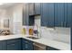 Modern kitchen sink and faucet with white quartz countertops at 7022 Prosperity Cir # 801, Sarasota, FL 34238
