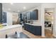 Modern kitchen with white quartz countertops and dark blue cabinetry at 7022 Prosperity Cir # 801, Sarasota, FL 34238