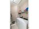 Laundry room with washer, dryer, and ample shelving at 7022 Prosperity Cir # 801, Sarasota, FL 34238