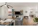 Open living room with wood-look floors and built-in shelving at 7022 Prosperity Cir # 801, Sarasota, FL 34238