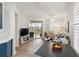Bright living room with access to a balcony overlooking a lake at 7022 Prosperity Cir # 801, Sarasota, FL 34238
