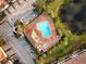 Community pool with plenty of lounge chairs and a hot tub at 7022 Prosperity Cir # 801, Sarasota, FL 34238