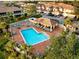 Community pool with plenty of lounge chairs and a covered patio area at 7022 Prosperity Cir # 801, Sarasota, FL 34238