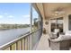 Serene screened balcony with lake and community view at 7022 Prosperity Cir # 801, Sarasota, FL 34238