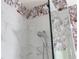 Modern shower with marble tile and toucan wallpaper at 7022 Prosperity Cir # 801, Sarasota, FL 34238